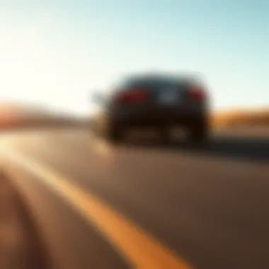 Jaguar F-Type R Coupe in motion on a winding road showcasing performance dynamics
