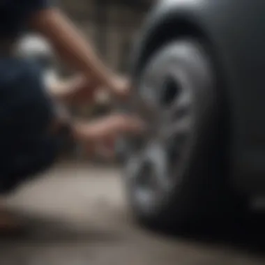 Professional applying a finishing touch to a repaired alloy rim