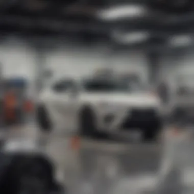 Toyota service center with technicians working on vehicles